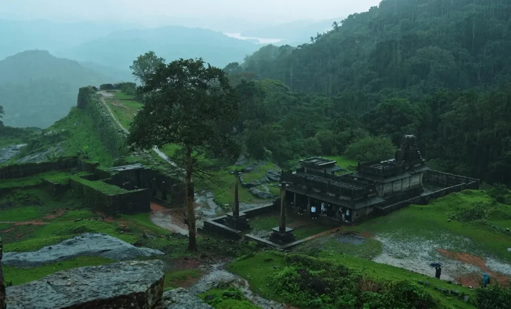 11 best places to visit in april in india Agumbe ancient stone temple surrounded by misty rainforest hills