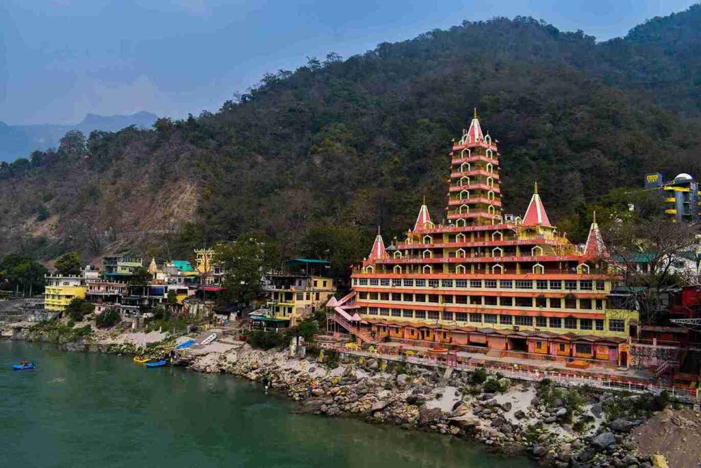 11 best places to visit in april in india Rishikesh Trayambakeshwar Temple by Ganges River with Himalayan foothills view