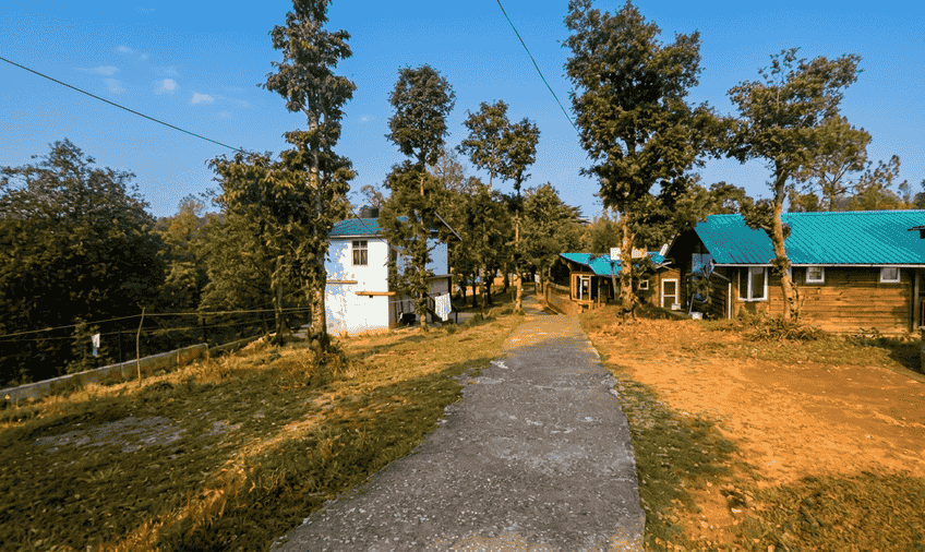 The image features the KMVN Abbott Mount Tourist Rest House located in Abbott Mount, Uttarakhand 