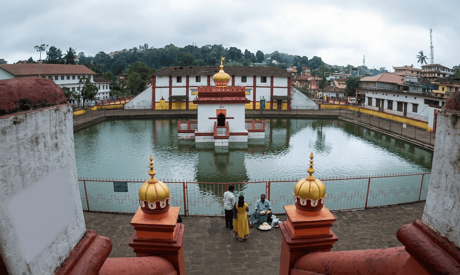 The scenic water tank surrounding the central shrine of Omkareshwara Temple, featured as one of the 23 best places to visit in Coorg in 2026.