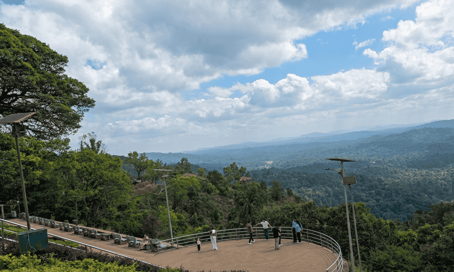 Scenic panoramic view of lush green hills and valleys from Raja's Seat, featured as one of the 23 best places to visit in Coorg in 2026.