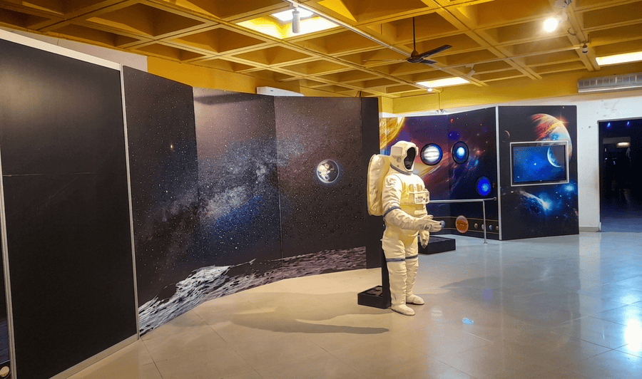 An interactive space exhibit and astronaut suit at Raman Science Centre, one of the 11 best things to do in Nagpur.