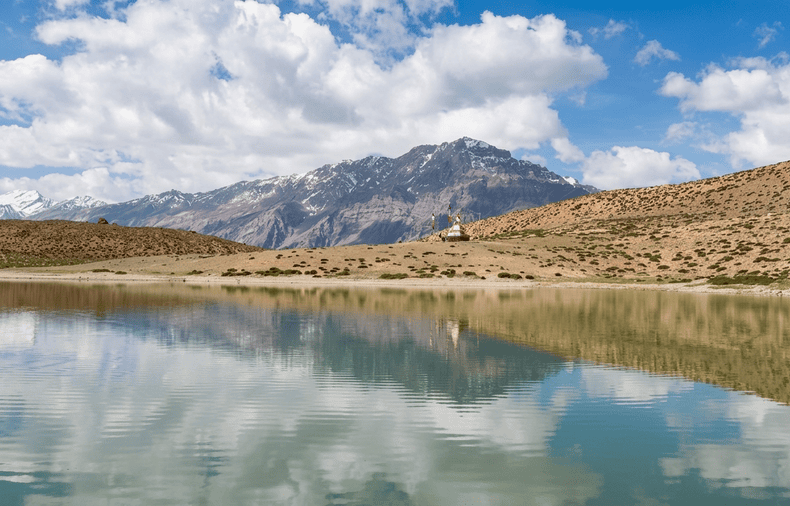 A view of Dhankar Lake in Spiti Valley, capturing its clear waters and mountain reflection. This high-altitude lake is a primary stop on our Spiti Itinerary for 3 Days.
