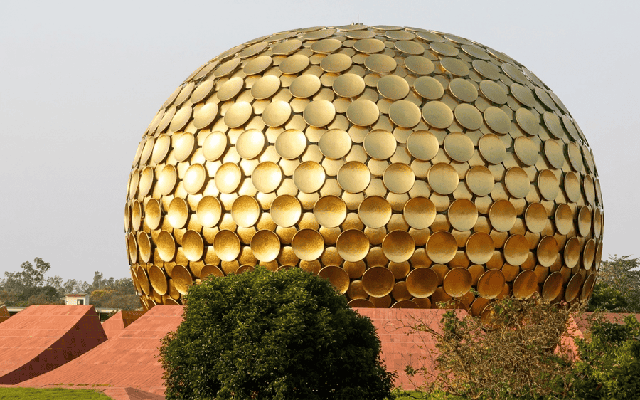 A viewpoint of the unique golden dome of the Matrimandir in Auroville, one of the best places to visit near Pondicherry for tourists seeking spiritual and cultural experiences.