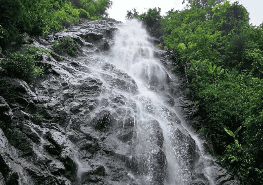 A high-quality panoramic shot of the stunning, multi-tiered Katiki Waterfalls, one of the best places to visit in Araku Valley for nature lovers.