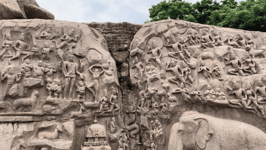 Intricate granite stone carvings depicting Arjuna's Penance, a central highlight among the best places to visit in Mahabalipuram.