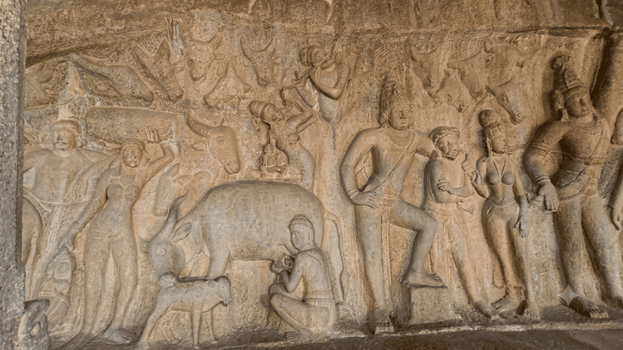 Intricate 7th-century Pallava cave temple carvings at Krishna Mandapam showcasing pastoral life, featured as one of the best places to visit Mahabalipuram.