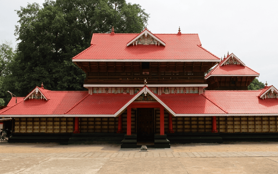Exterior view of the multi-tiered red-roofed Sarkara Devi Temple, a top choice among best places to visit in Varkala for heritage tours.