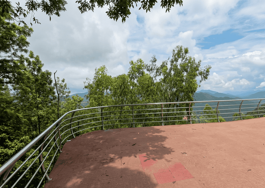 A panoramic view of the lush, rolling mountains from the pristine Galikonda View Point platform, one of the best places to visit in Araku Valley.