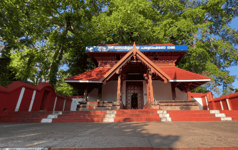 Front elevation of the historic Janardhana Swamy Temple with red steps and wooden entry – best places to visit Varkala guide