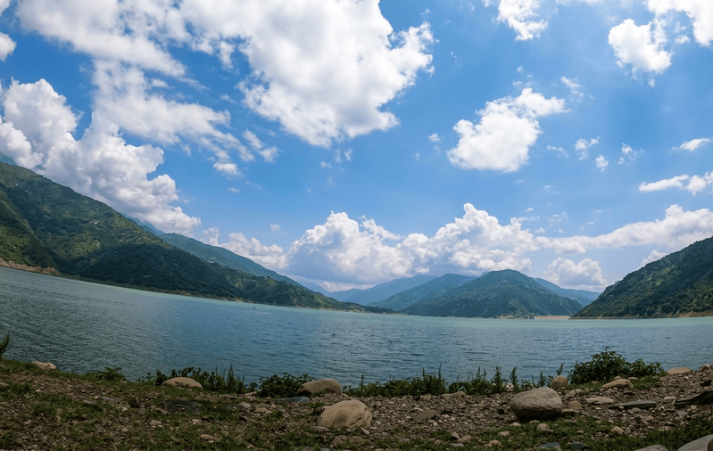 Scenic water reservoir at Kanatal - best places to visit Uttarakhand guide