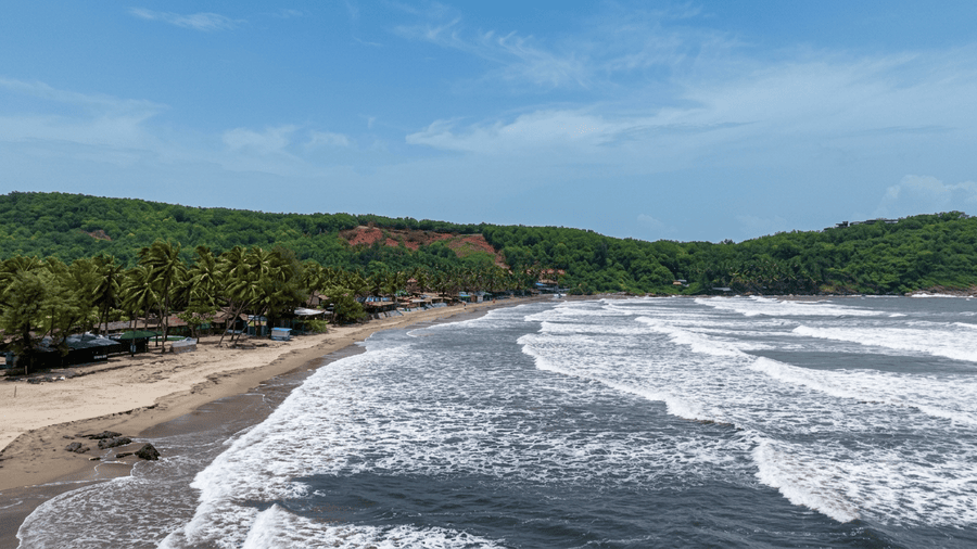 Scenic coastline and ocean waves crashing on Kudle Beach - best places to visit Gokarna guide