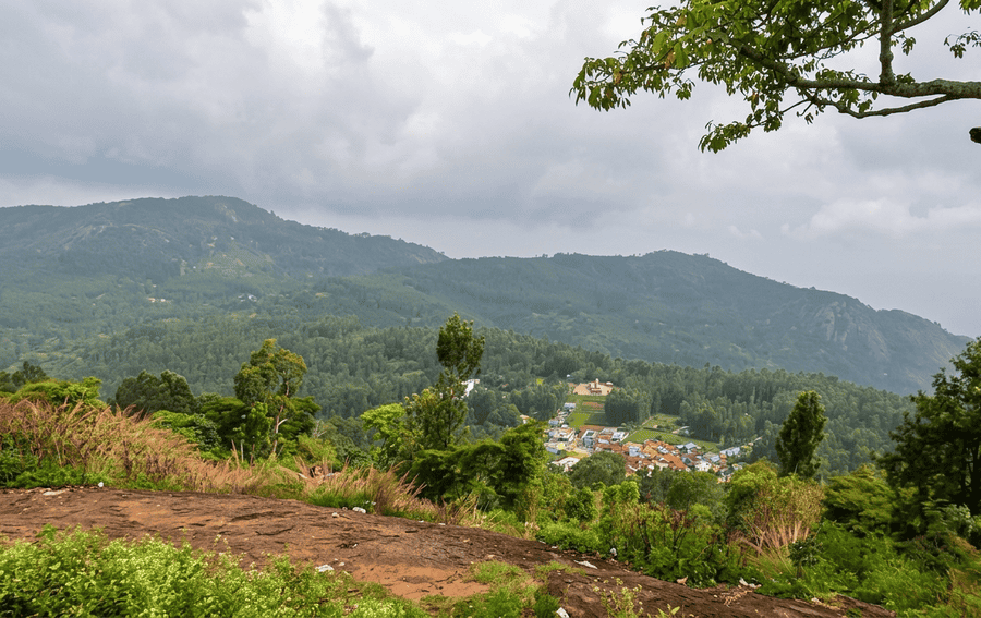 A detailed view of the small village tucked into the forested hills, seen from the Pagoda Point viewpoint, a top entry for best places to visit in Yercaud.